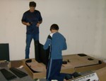 Boys building Air Hockey table