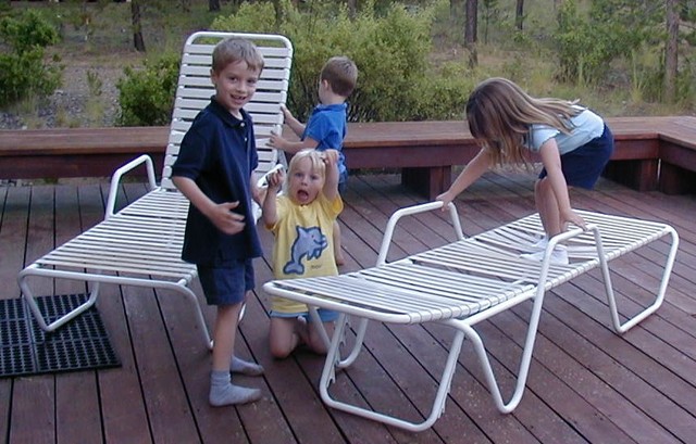 Cousin playing on chairs