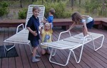 Cousin playing on chairs